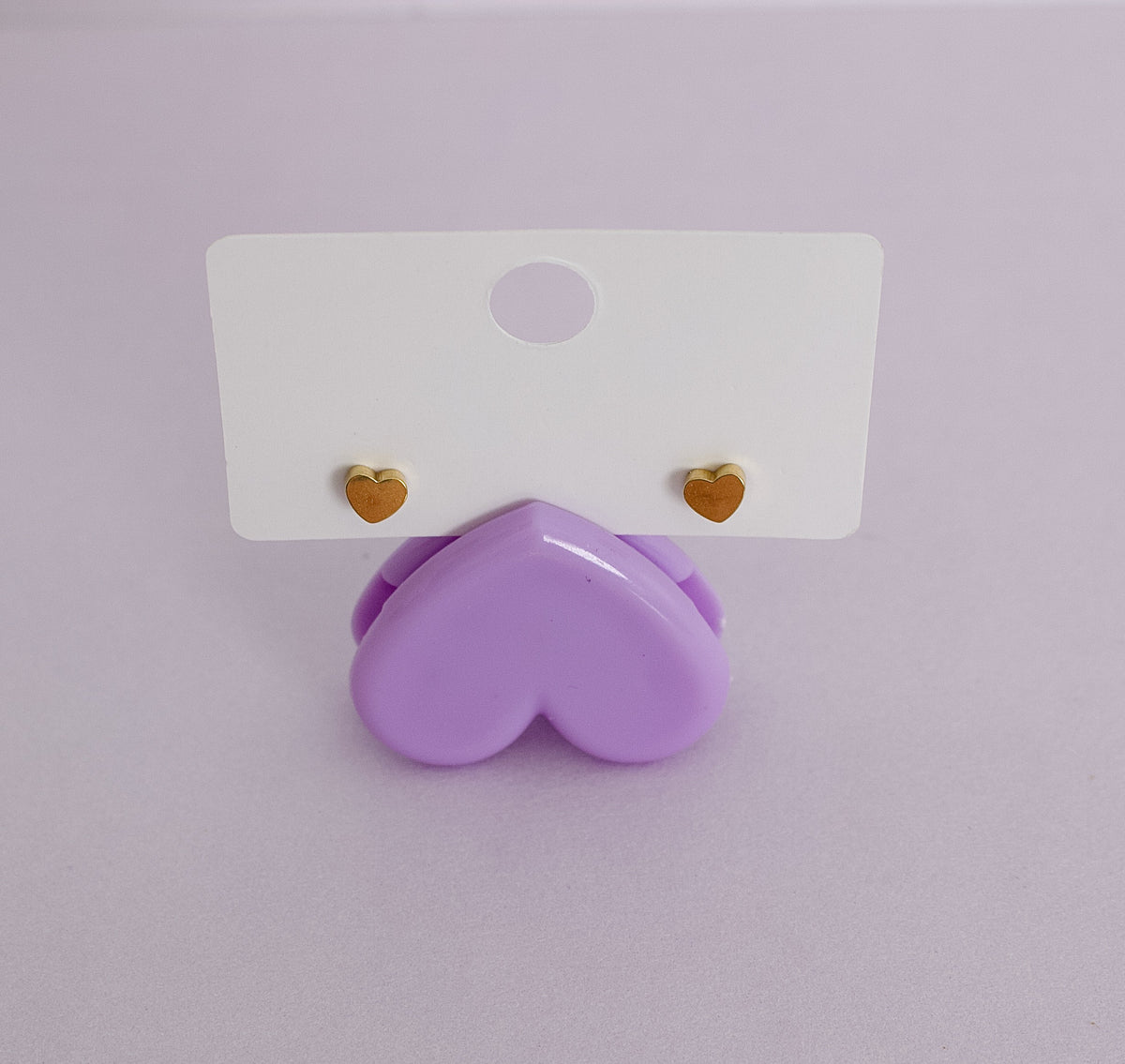 A pair of hypoallergenic heart shaped screwbacks for stud earrings from The Pierced Peanut.