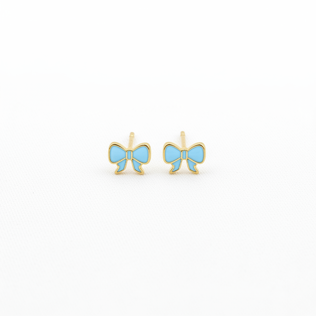 Blue bow stud earrings on white background