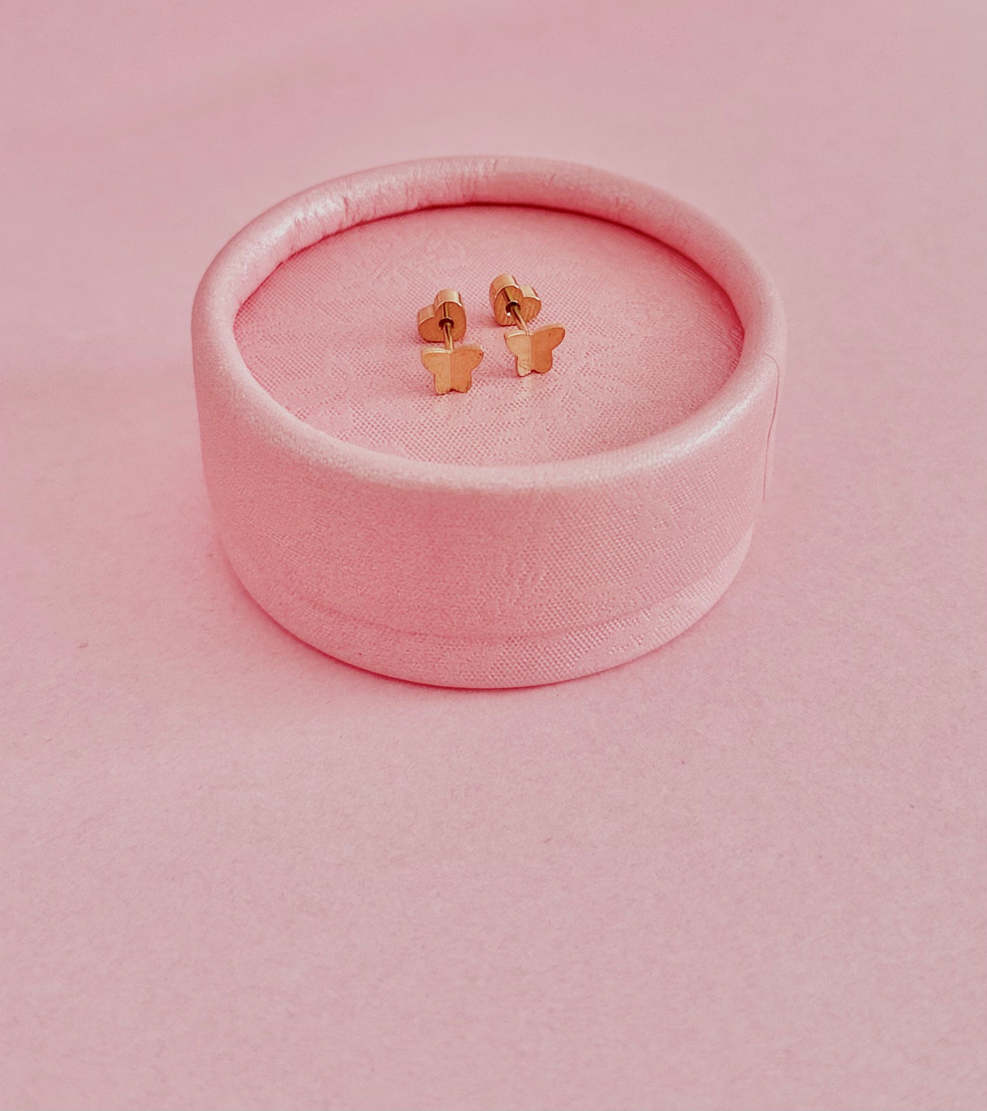 Pair of gold butterfly hypoallergenic screwback stud earrings made by The Pierced Peanut for kids