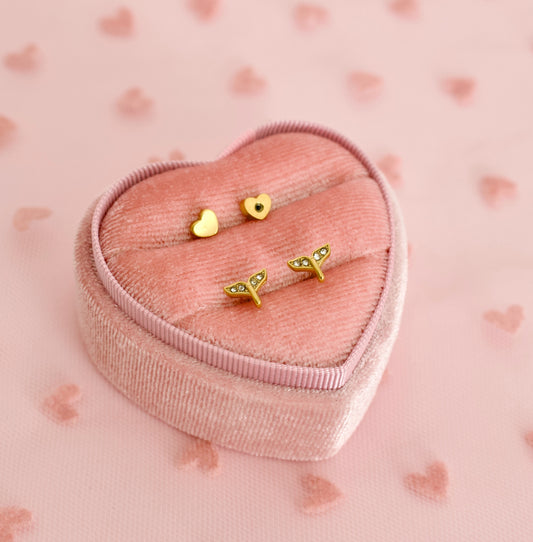 A Pair of kids hypoallergenic screwback stud earrings shaped as mermaid tails from The Pierced Peanut earring company