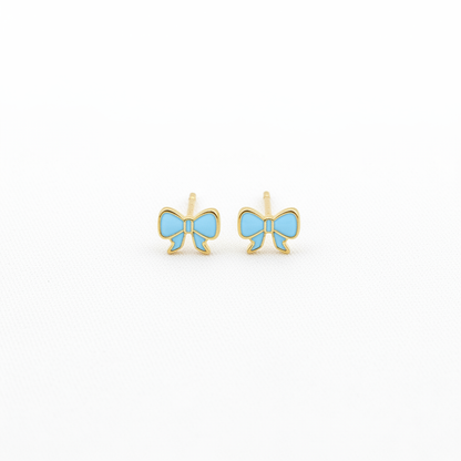 Blue bow stud earrings on white background