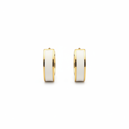White flat huggie earrings on white background