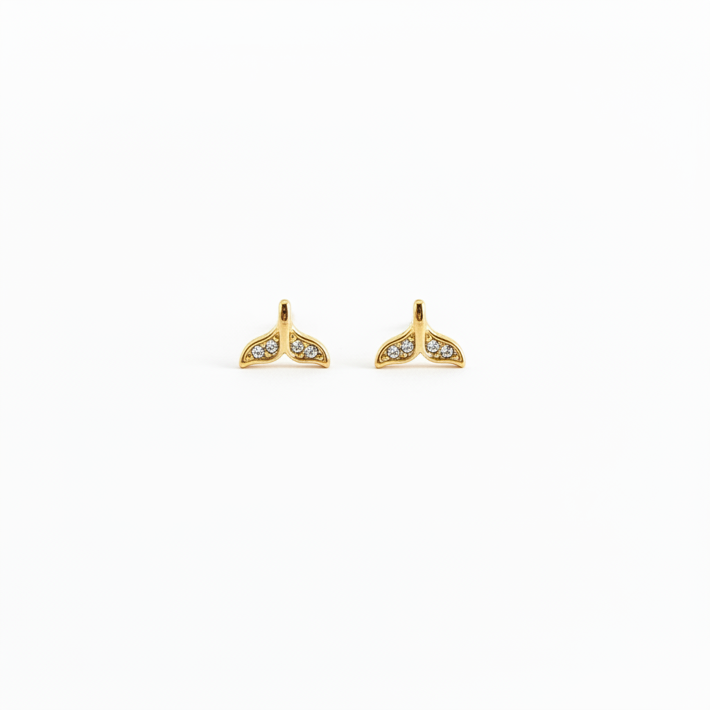 Diamond mermaid tail stud earrings on white background
