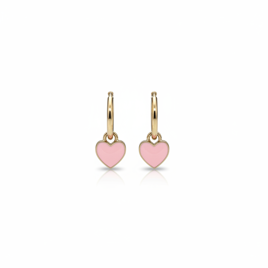 Pink heart huggie earrings on white background