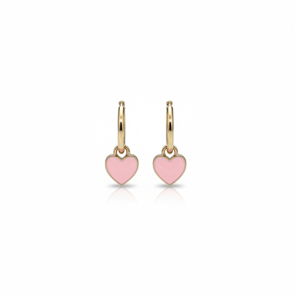 Pink heart huggie earrings on white background